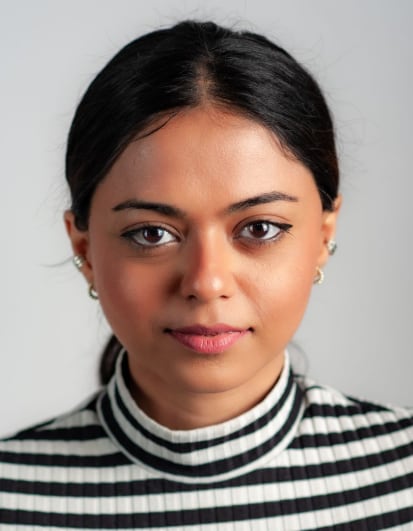 Head-and-shoulders photo of a woman in a striped top, cropped to 35 × 45 mm